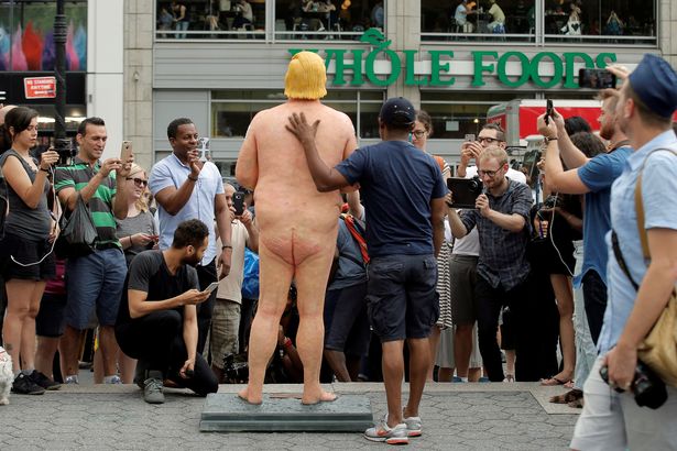 People-photograph-a-naked-statue-of-Republican-US-presidential-nominee-Donald-Trump-that-was-left[1]