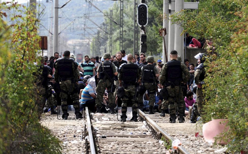 Macedonian special policemen guard the border as more than a thousand immigrants wait at the border line of Macedonia and Greece to enter Macedonia near the Gevgelija railway station Macedonian special policemen guard the border as more than a thousand immigrants wait at the border line of Macedonia and Greece to enter Macedonia near the Gevgelija railway station