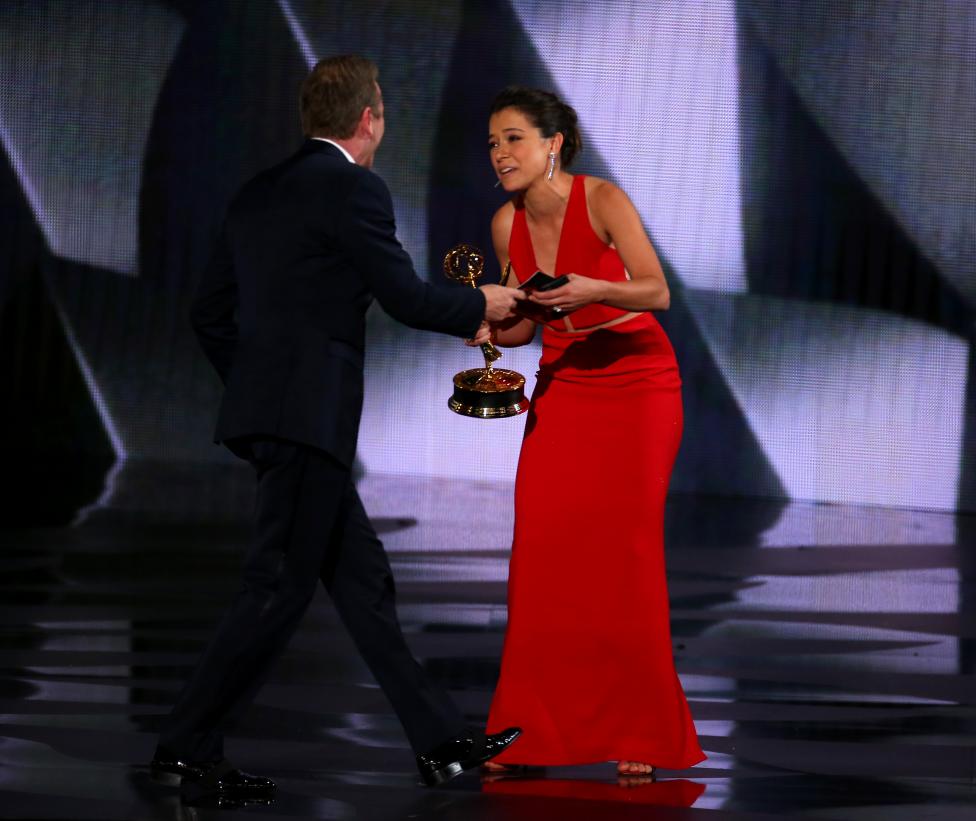 Presenter Sutherland congratulates Maslany after she won the award for Outstanding Lead Actress In A Drama Series at the 68th Primetime Emmy Awards in Los Angeles