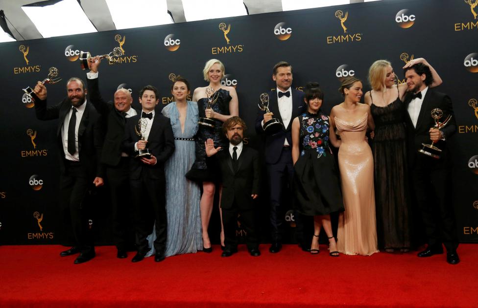 The cast of HBO's "Game of Thrones" pose backstage with their awardS at the 68th Primetime Emmy Awards in Los Angeles, California